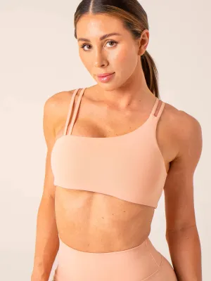 Unstoppable One Shoulder Sports Bra - Peach stretchy fabric