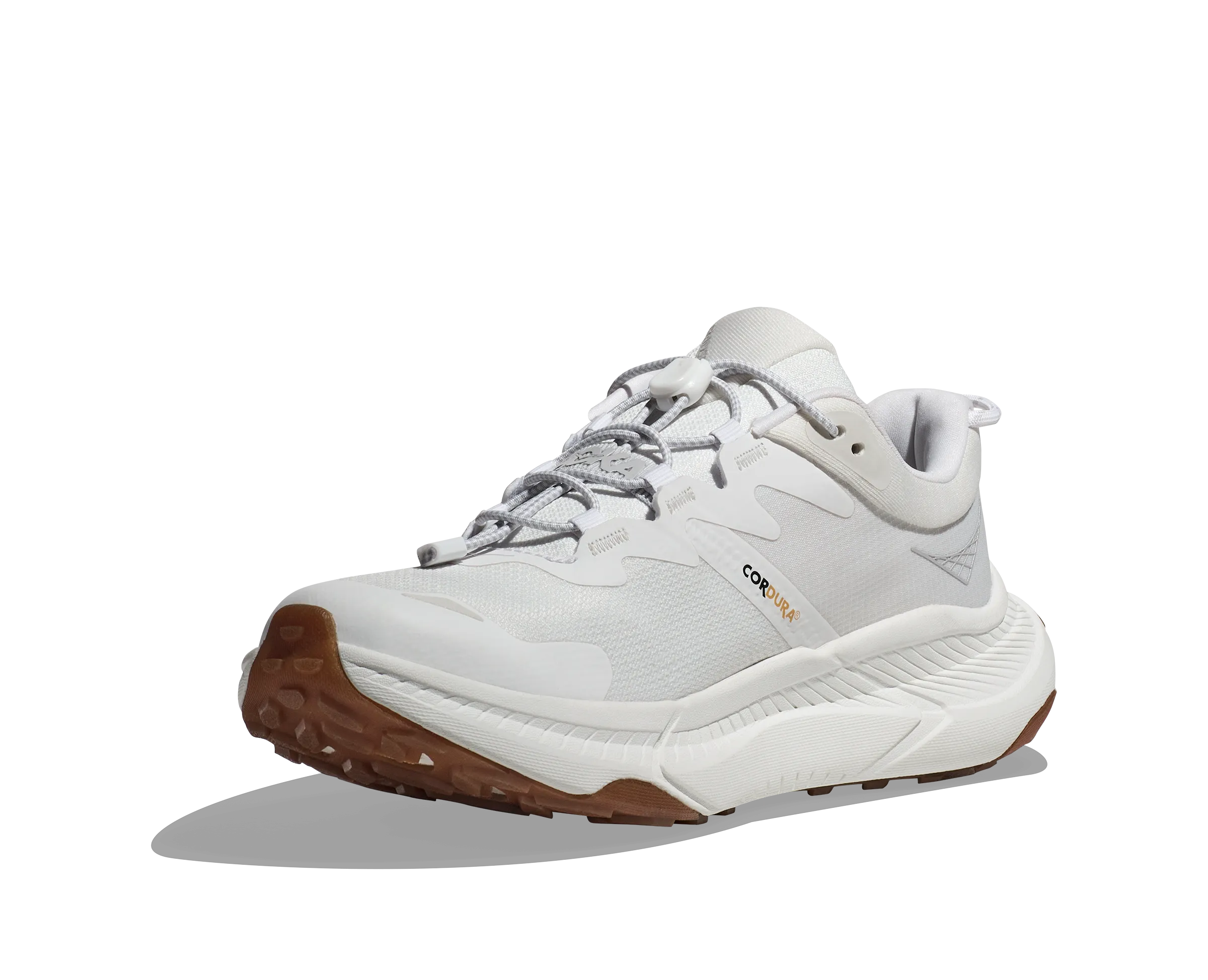 Vertical Flex Flexibility running in a lava field area shoes HOKA TRANSPORT WHITE